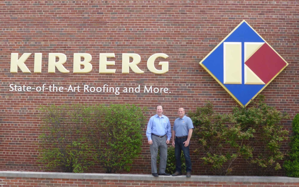 kirberg owners in front of the kirberg building