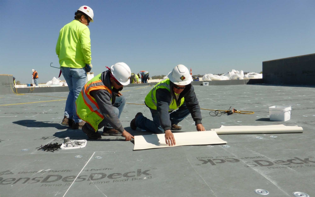 men at work on a roof