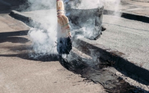 tar-being-spread-on-built-up-roof