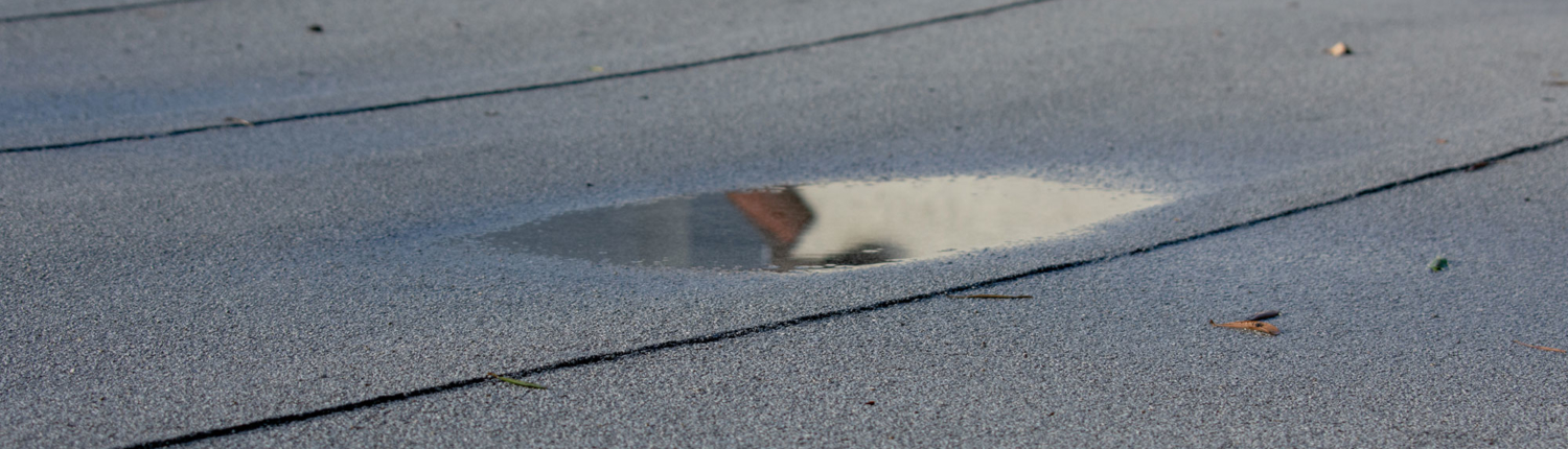 How to Handle Flat Roof Wind Damage